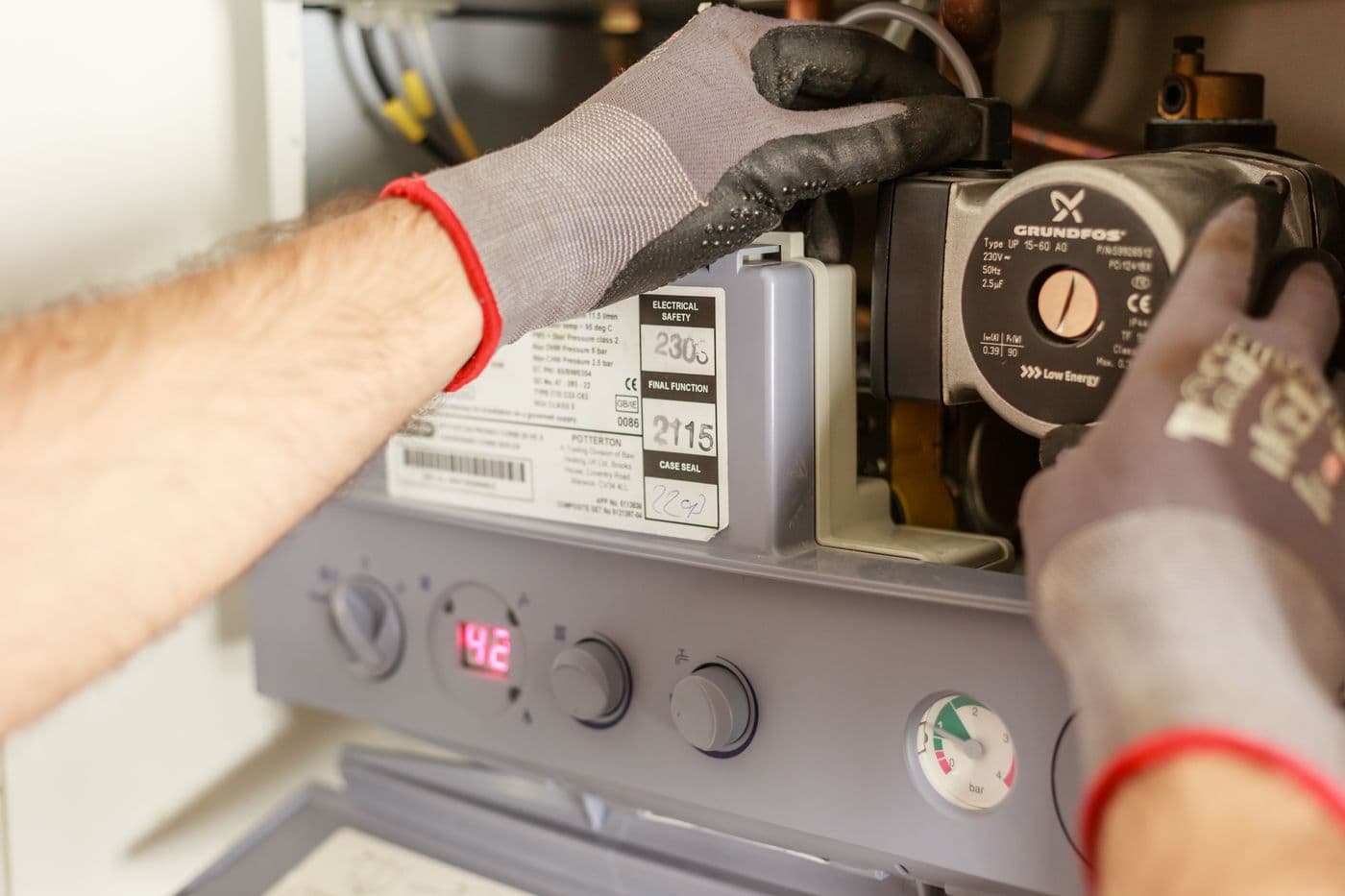 Gas Safe engineer working on a boiler